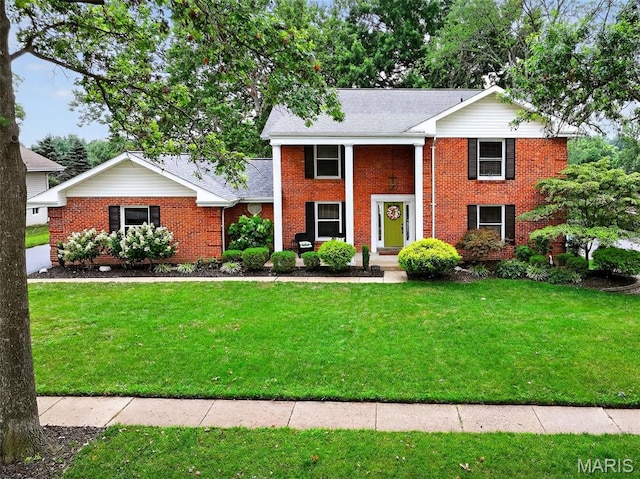 538 Kenilworth Ln, Ballwin, MO 63011 - neoclassical home featuring a front yard, brick siding, and a shingled roof