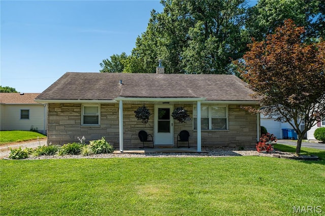 2004 Cottage Ave, Granite City, IL 62040 - view of front of home featuring stone siding, covered porch, a front yard, and roof with shingles
