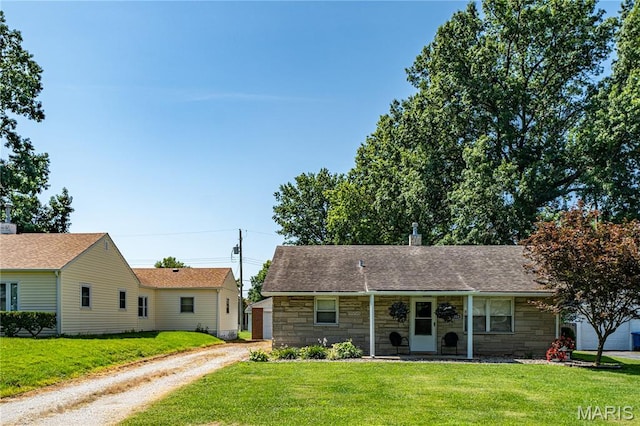 2004 Cottage Ave, Granite City, IL 62040 - view of front of house with stone siding, driveway, and a front yard