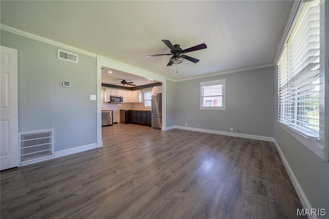 2004 Cottage Ave, Granite City, IL 62040 - unfurnished living room featuring ceiling fan, ornamental molding, dark wood-type flooring, and a textured ceiling