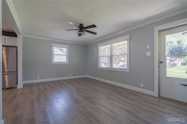 2004 Cottage Ave, Granite City, IL 62040 - unfurnished room featuring ornamental molding, a textured ceiling, wood finished floors, and a ceiling fan