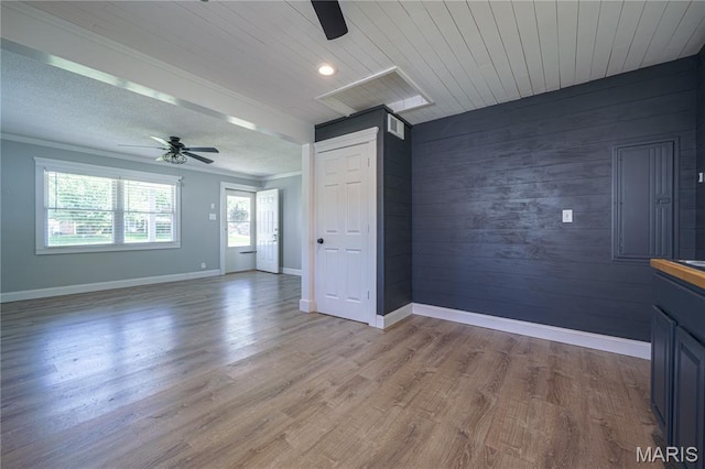 2004 Cottage Ave, Granite City, IL 62040 - unfurnished room with a ceiling fan, wood walls, light wood-type flooring, ornamental molding, and wood ceiling