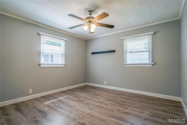 2004 Cottage Ave, Granite City, IL 62040 - empty room featuring crown molding, wood finished floors, a textured ceiling, and a ceiling fan