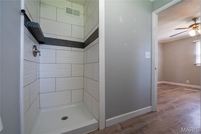 2004 Cottage Ave, Granite City, IL 62040 - full bath with a tile shower, wood finished floors, and ceiling fan