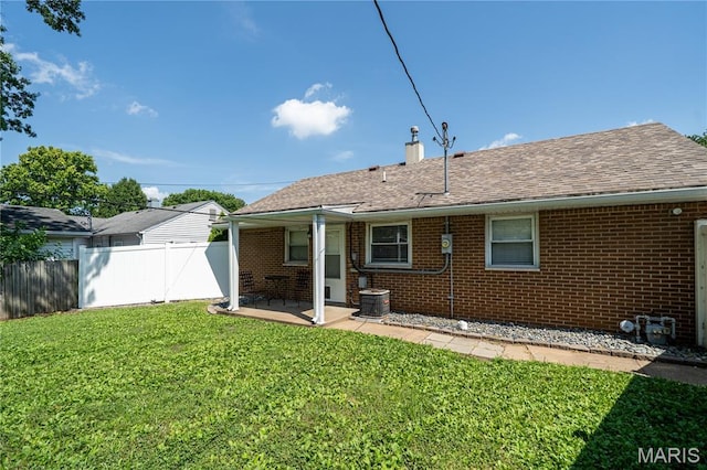 2004 Cottage Ave, Granite City, IL 62040 - back of house with brick siding, a chimney, a patio, and a shingled roof