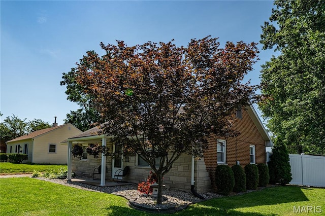 2004 Cottage Ave, Granite City, IL 62040 - view of front of house with stone siding and a patio area