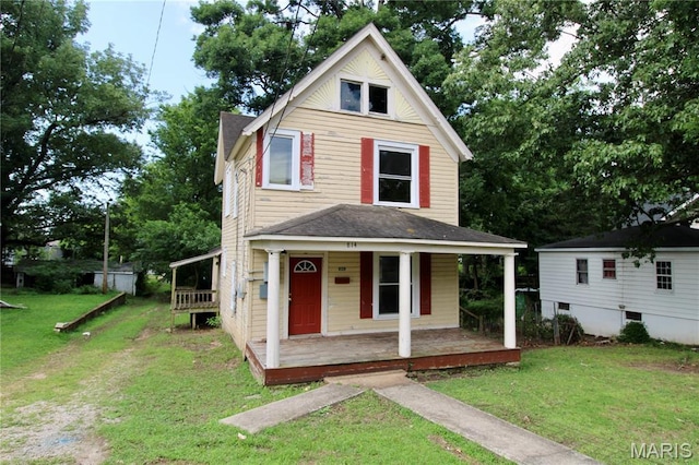 814 Vine St, Poplar Bluff, MO 63901 - view of front of property with a porch, roof with shingles, and a front lawn