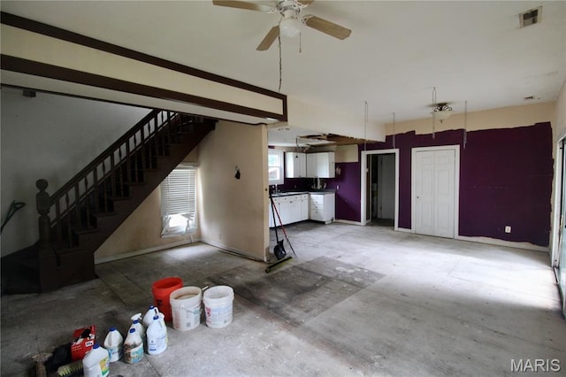 814 Vine St, Poplar Bluff, MO 63901 - unfurnished living room with ceiling fan and stairs
