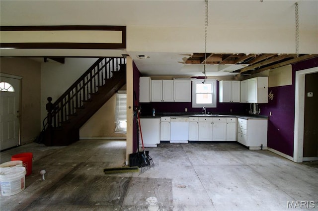 814 Vine St, Poplar Bluff, MO 63901 - kitchen with dishwasher, white cabinets, and dark countertops