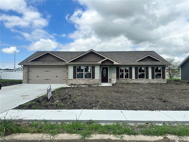 521 Somerset Dr, Granite City, IL 62040 - craftsman-style house featuring driveway, an attached garage, a shingled roof, and brick siding