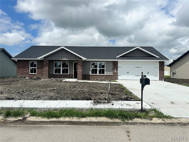 525 Somerset Dr, Granite City, IL 62040 - view of front of property featuring brick siding, driveway, and a garage