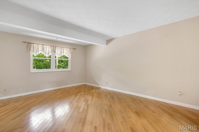 127 Hilltop Trl, Eureka, MO 63025 - unfurnished room with light wood-type flooring and beam ceiling