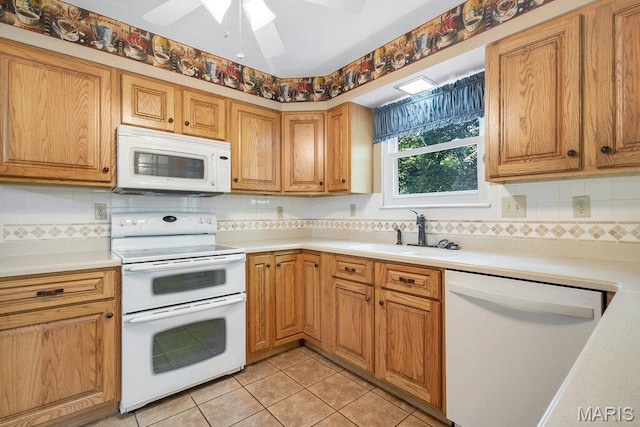 127 Hilltop Trl, Eureka, MO 63025 - kitchen with white appliances, tasteful backsplash, light countertops, and a ceiling fan
