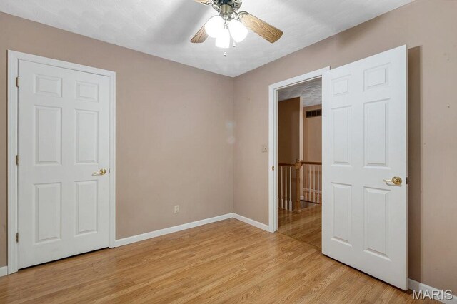 127 Hilltop Trl, Eureka, MO 63025 - unfurnished bedroom featuring light wood-style floors and ceiling fan