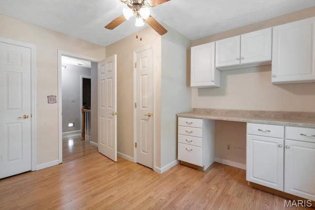 127 Hilltop Trl, Eureka, MO 63025 - kitchen with ceiling fan, light wood finished floors, white cabinets, and light countertops