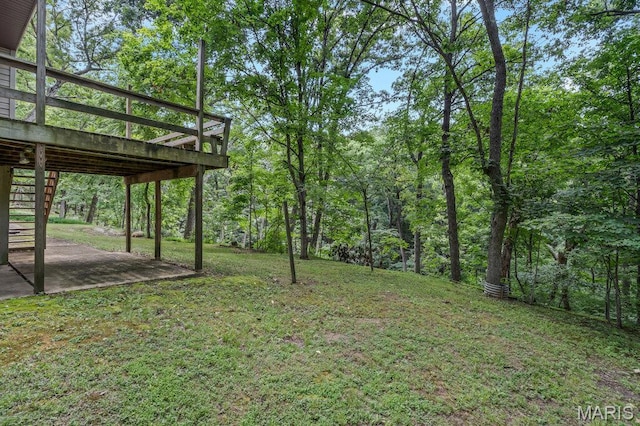 127 Hilltop Trl, Eureka, MO 63025 - view of grassy yard featuring a patio, a wooden deck, and stairs