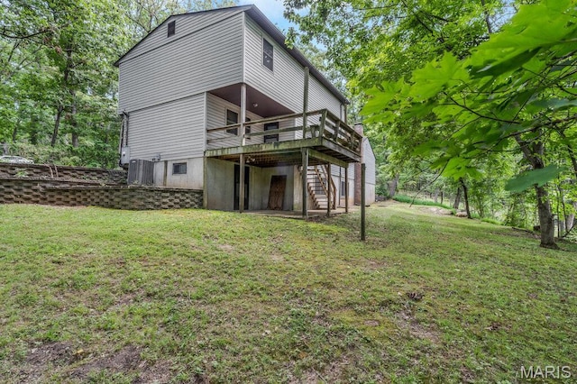 127 Hilltop Trl, Eureka, MO 63025 - back of property with stairs, a wooden deck, and a lawn