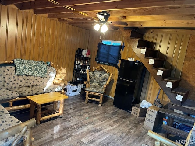 421 Park Ln, Union, MO 63084 - living room with stairway, wood walls, ceiling fan, and wood finished floors