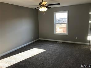 1158 Marathon Dr, Foristell, MO 63348 - spare room with dark colored carpet and a ceiling fan
