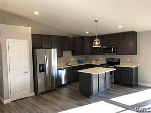 1158 Marathon Dr, Foristell, MO 63348 - kitchen with stainless steel appliances, dark wood-style flooring, light countertops, pendant lighting, and a kitchen island