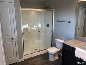 1158 Marathon Dr, Foristell, MO 63348 - bathroom featuring vanity, a shower stall, and wood finished floors