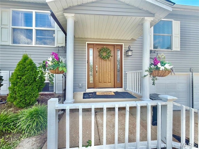 2284 Sunnyridge Dr, Arnold, MO 63010 - doorway to property featuring a garage and a porch