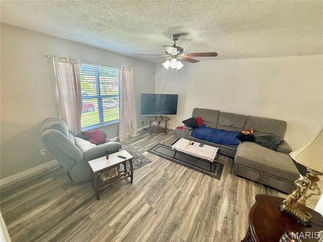 2284 Sunnyridge Dr, Arnold, MO 63010 - living area with wood finished floors, ceiling fan, and a textured ceiling