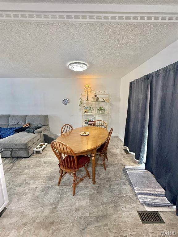 2284 Sunnyridge Dr, Arnold, MO 63010 - dining area with a textured ceiling