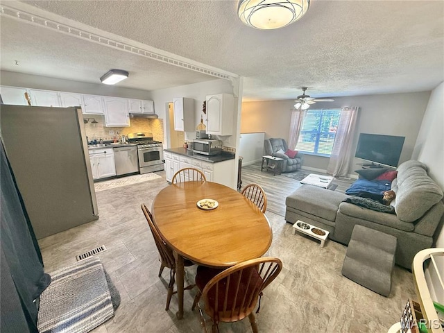 2284 Sunnyridge Dr, Arnold, MO 63010 - dining area with a textured ceiling and ceiling fan