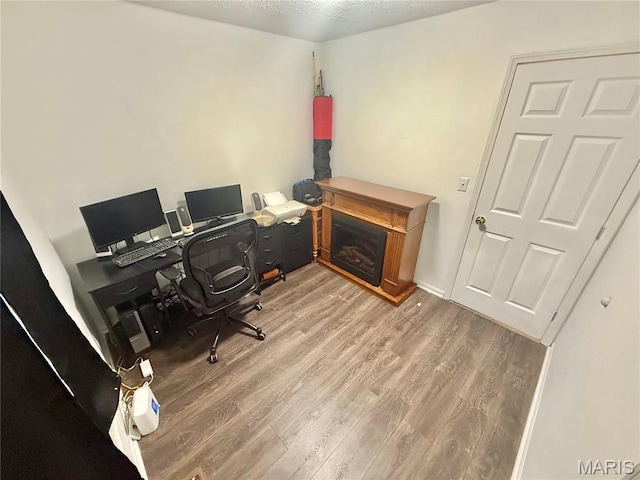 2284 Sunnyridge Dr, Arnold, MO 63010 - office with wood finished floors and a glass covered fireplace