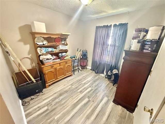 2284 Sunnyridge Dr, Arnold, MO 63010 - office area featuring light wood finished floors and a textured ceiling