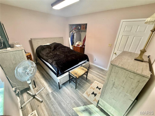 2284 Sunnyridge Dr, Arnold, MO 63010 - bedroom featuring wood finished floors and baseboards