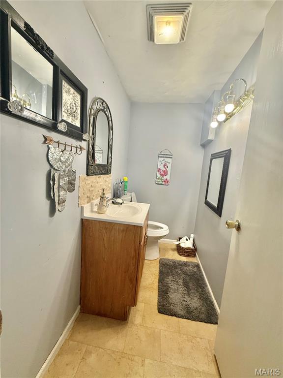 2284 Sunnyridge Dr, Arnold, MO 63010 - bathroom featuring toilet and vanity