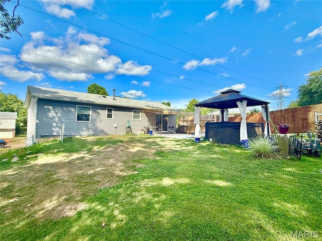 2284 Sunnyridge Dr, Arnold, MO 63010 - fenced backyard with a hot tub, a gazebo, and a patio area