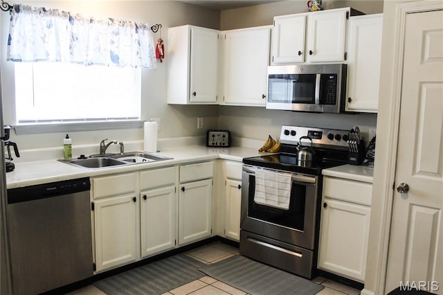 761 Sugar Glen Dr Unit 5, Saint Peters, MO 63376 - kitchen with stainless steel appliances, light countertops, tile patterned floors, and white cabinets