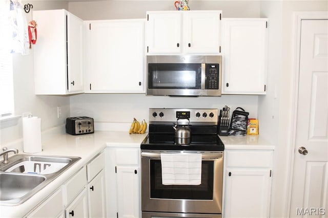761 Sugar Glen Dr Unit 5, Saint Peters, MO 63376 - kitchen with stainless steel appliances, white cabinets, and light countertops