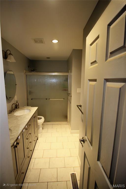 2890 Tommy Dr, Arnold, MO 63010 - full bath with vanity, a shower with door, recessed lighting, and tile patterned flooring