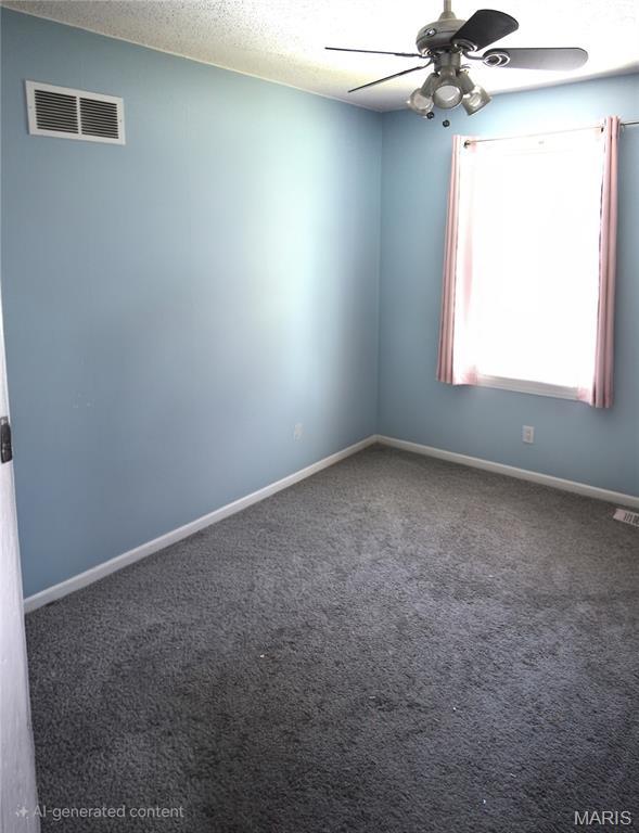 2890 Tommy Dr, Arnold, MO 63010 - empty room featuring ceiling fan, carpet floors, and a textured ceiling