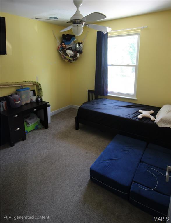 2890 Tommy Dr, Arnold, MO 63010 - bedroom with carpet flooring and a ceiling fan