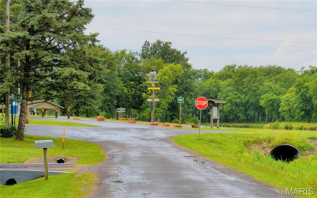 314 Lubeck St, Marine, IL 62061 - view of asphalt road featuring traffic signs