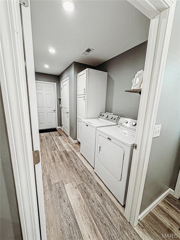 9 Powers Ln, Sikeston, MO 63801 - washroom with washer and dryer, light wood-type flooring, and recessed lighting