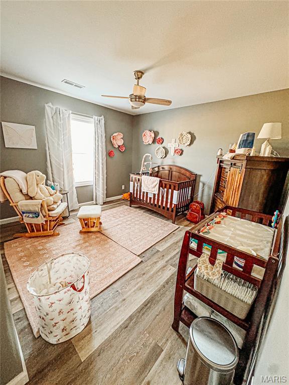 9 Powers Ln, Sikeston, MO 63801 - bedroom featuring wood finished floors and ceiling fan