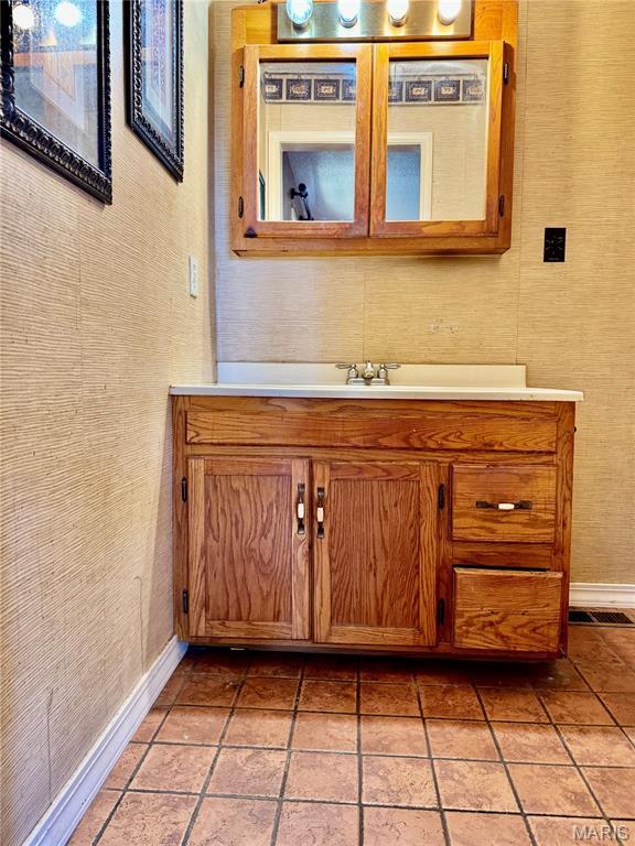 5250 Wren Ln, Osage Beach, MO 65065 - bathroom featuring vanity and baseboards