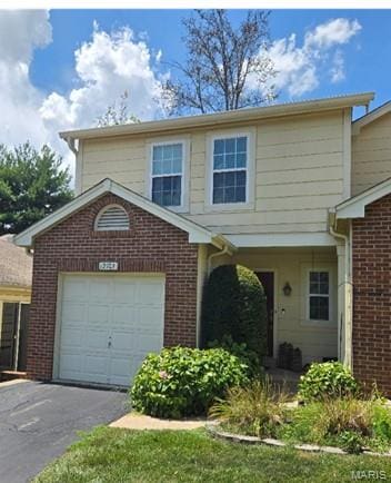 12103 Autumn Lakes Dr, Maryland Heights, MO 63043 - view of front of property with driveway and brick siding