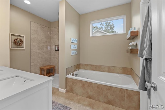 9882 W Vista Dr, Hillsboro, MO 63050 - full bathroom featuring a garden tub, a walk in shower, tile patterned floors, and double vanity