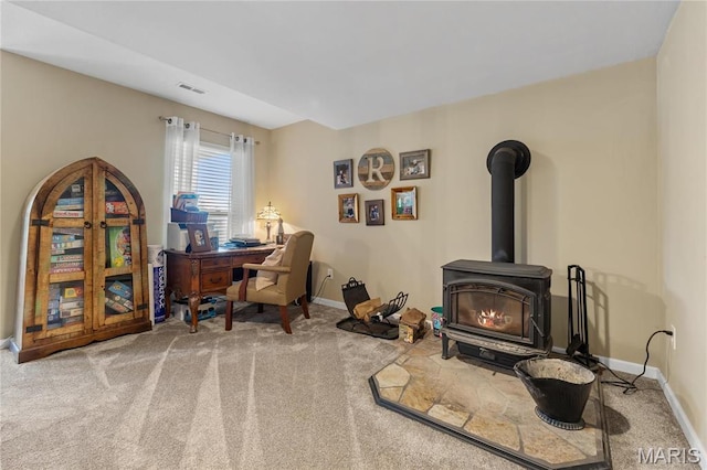 9882 W Vista Dr, Hillsboro, MO 63050 - carpeted office space with baseboards and a wood stove