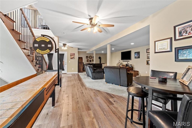 9882 W Vista Dr, Hillsboro, MO 63050 - living area featuring a ceiling fan, light wood-style floors, stairway, and recessed lighting