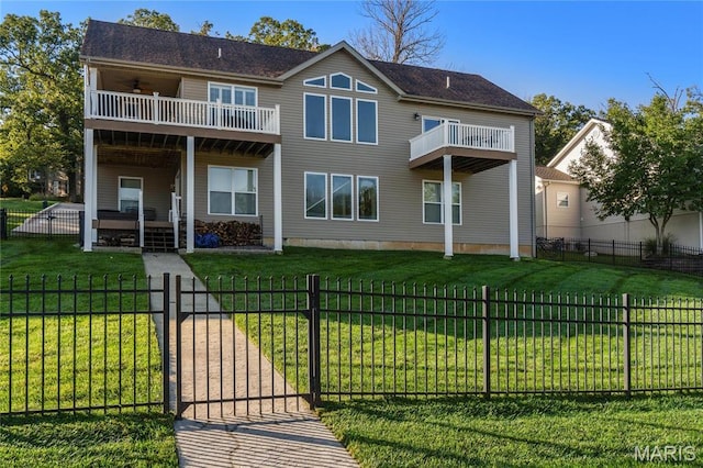 9882 W Vista Dr, Hillsboro, MO 63050 - rear view of house with a balcony, ceiling fan, and a fenced front yard