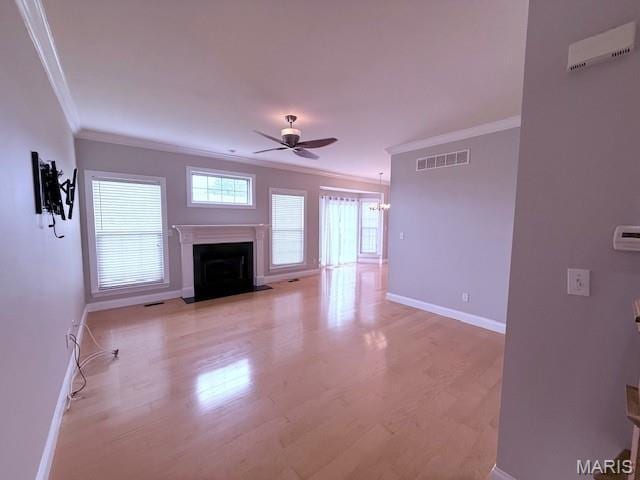 205 Prominence Ln, Lake St Louis, MO 63367 - unfurnished living room featuring ornamental molding, a ceiling fan, light wood-style flooring, and a fireplace with flush hearth