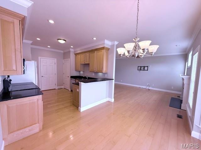 205 Prominence Ln, Lake St Louis, MO 63367 - kitchen with a chandelier, ornamental molding, dark countertops, light wood-style floors, and recessed lighting